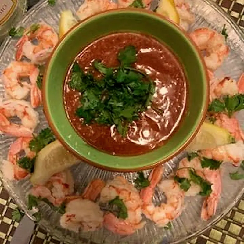 Chilled shrimp cocktail platter with lemon and sauce