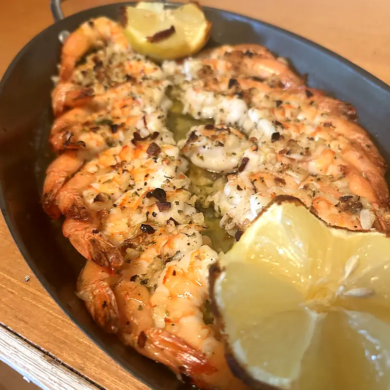 Baked seafood with herbs and lemon straight from the pan
