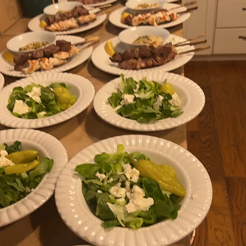 Individually plated salads prepared for a dinner party